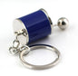Blue mini gear shift keychain with a polished metallic design on a white background