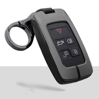 Gunmetal grey Range Rover-style key fob with black leather-shell sides and metallic gun-finish keychain attachment displayed on a clean light background