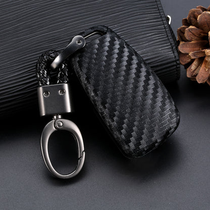 Premium carbon fiber car key case with durable braided keychain on a dark background