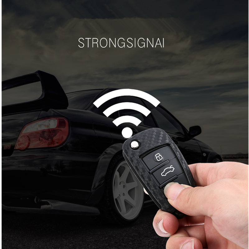 Hand holding a premium car key fob remote with strong signal feature and a blurred car in the background – durable key cover for vehicles