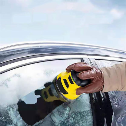 Cordless electric snow scraper clearing ice from a car windshield – handheld winter ice remover in action.